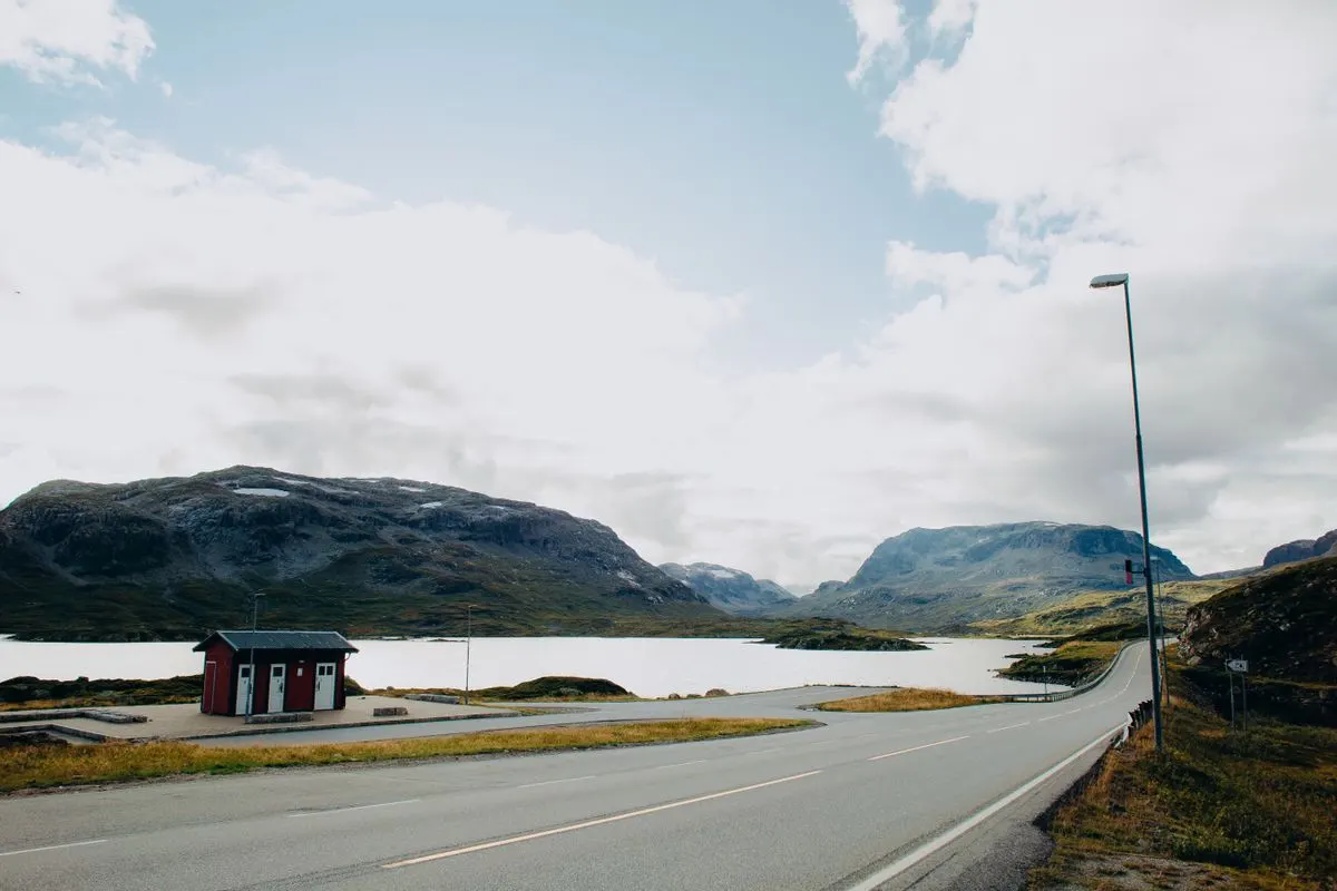 A road beside a mountain lake